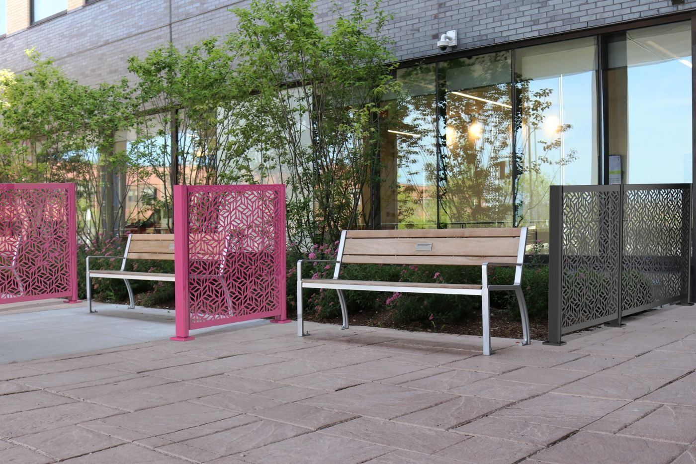 970 backed benches and Flexx panels in front of building with trees