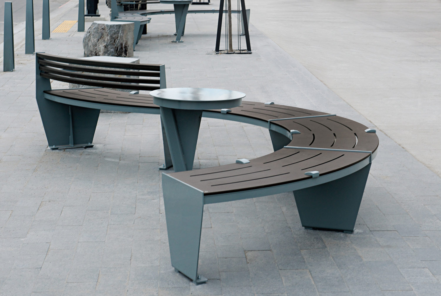 Curved S Bench with side table and skate deterrents