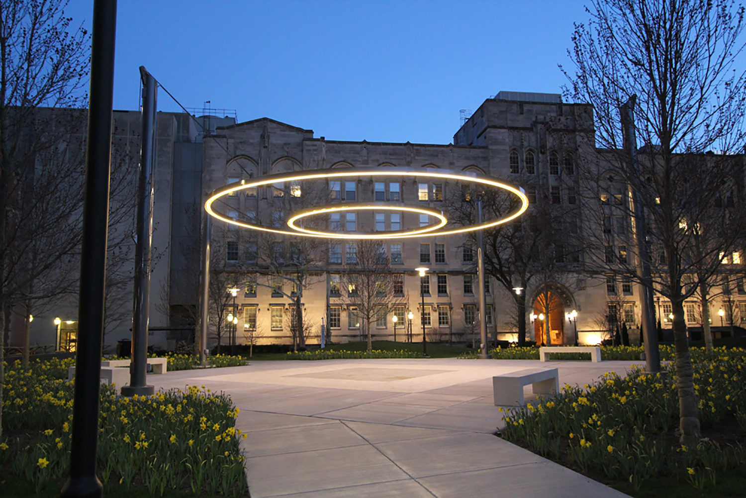 Crerar Quad Circle of Light suspended by four posts at the University of Chicago