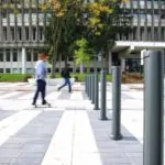 Bollards outside Laval University with man walking