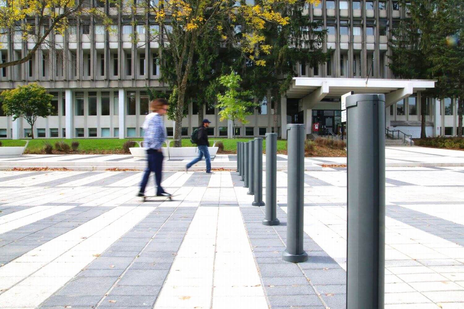 Bollards outside Laval University with man walking