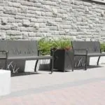 970 Benches and 400 Planters against stone wall