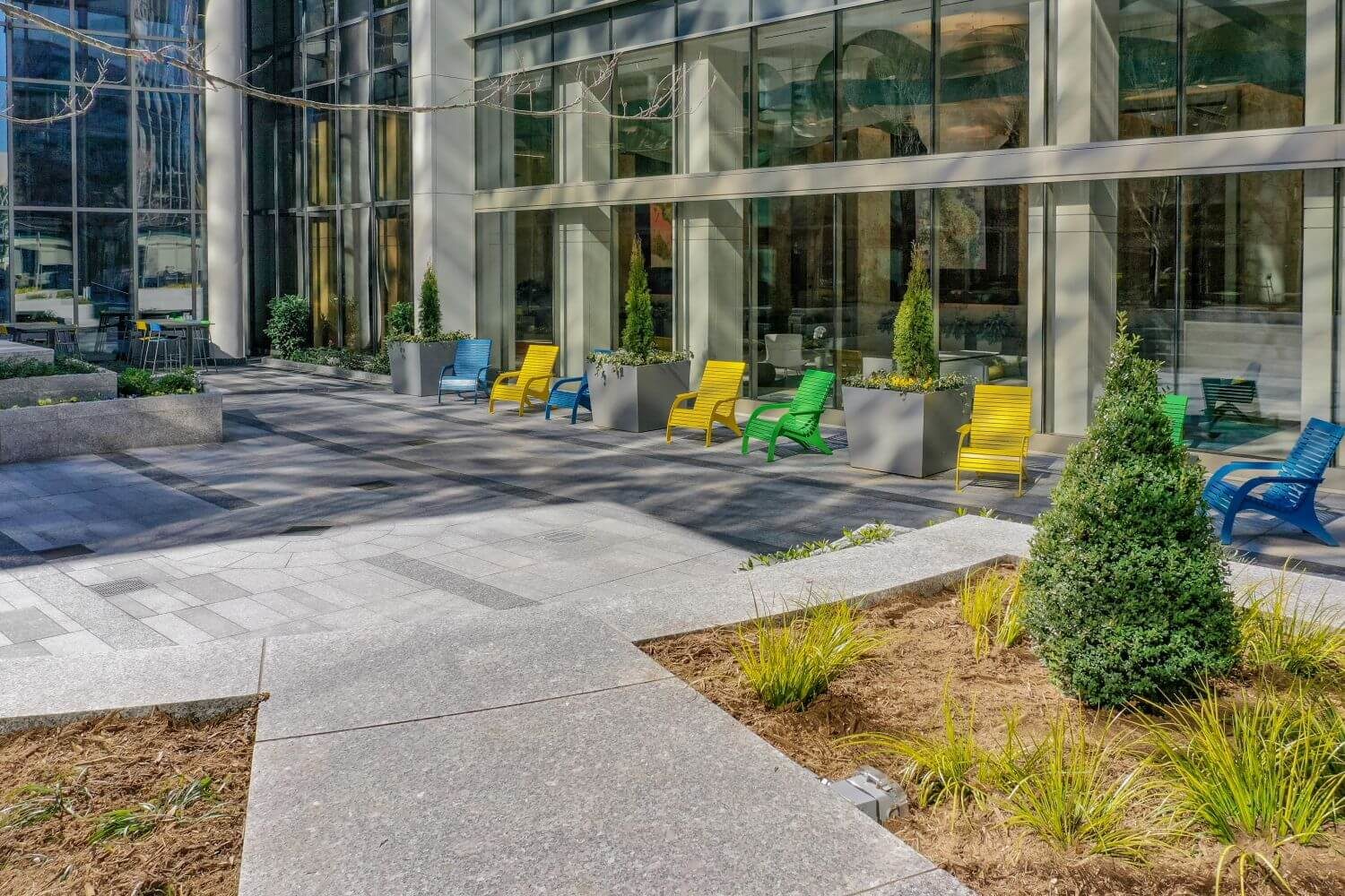 700 Series - 720 Chairs at Bank of America Yellow, Green and Blue patio seating outside glass building
