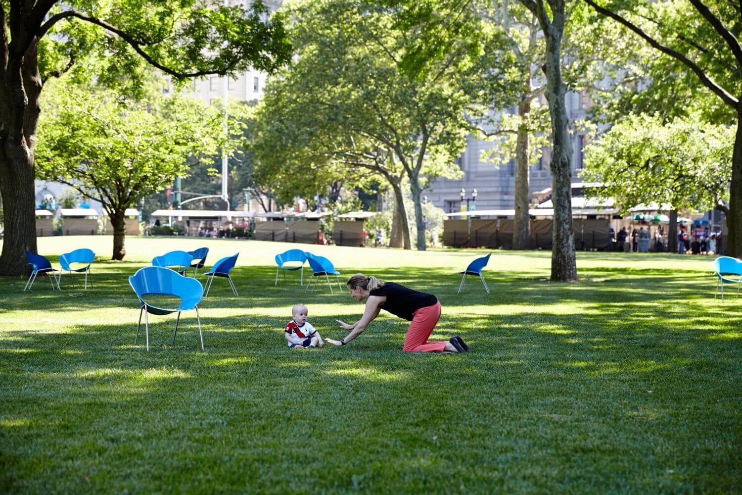 HOME_INSTALLATIONS_TABLES & SEATING_Battery Park_Battery Chairs (2) Blue chairs with woman and child