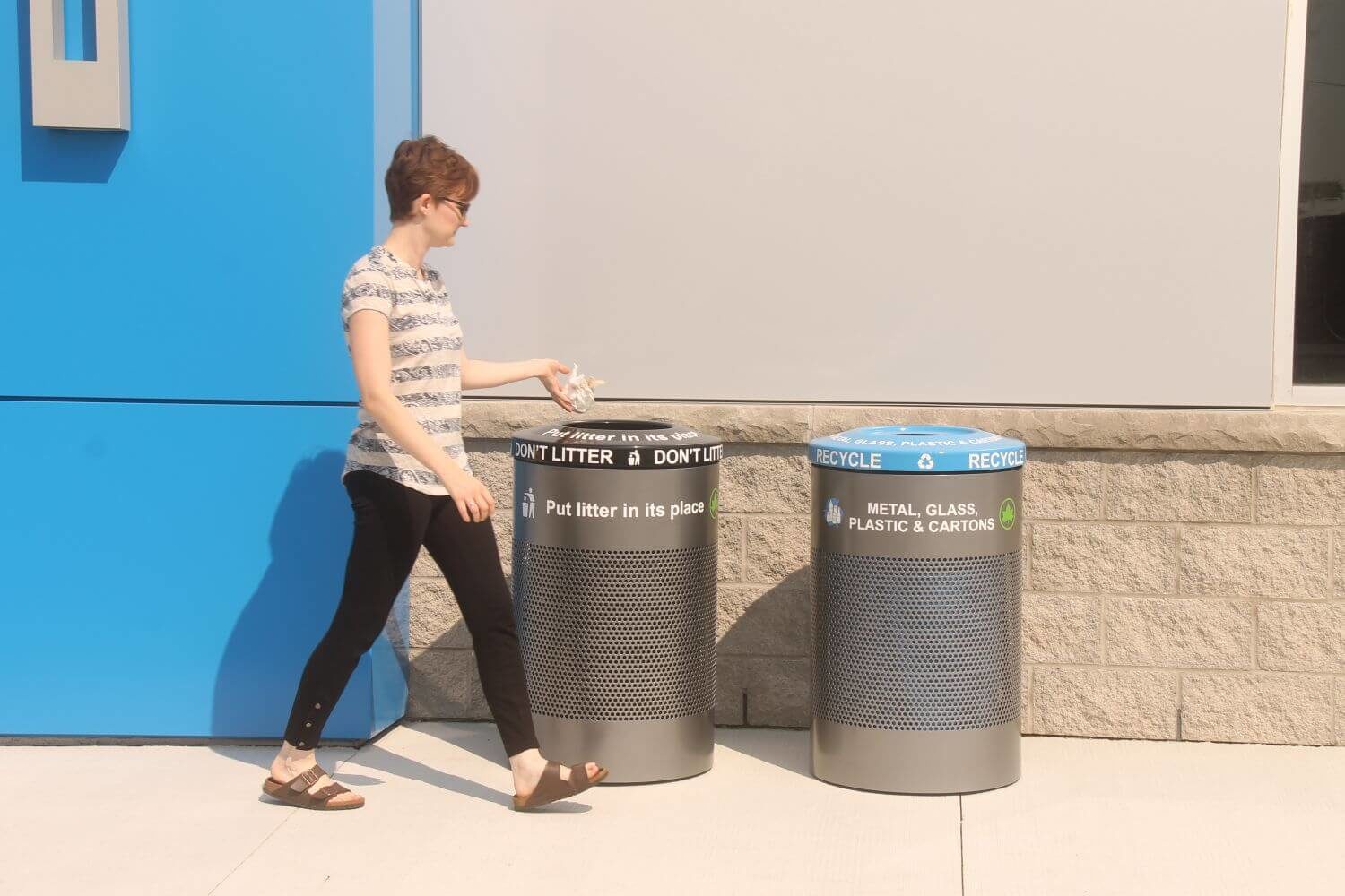 600 Series - 600 Trash and Recycle Container Woman throwing trash into a 600 series trash container