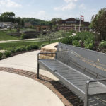Custom laser cut Bee Branch Creek Bench in park setting