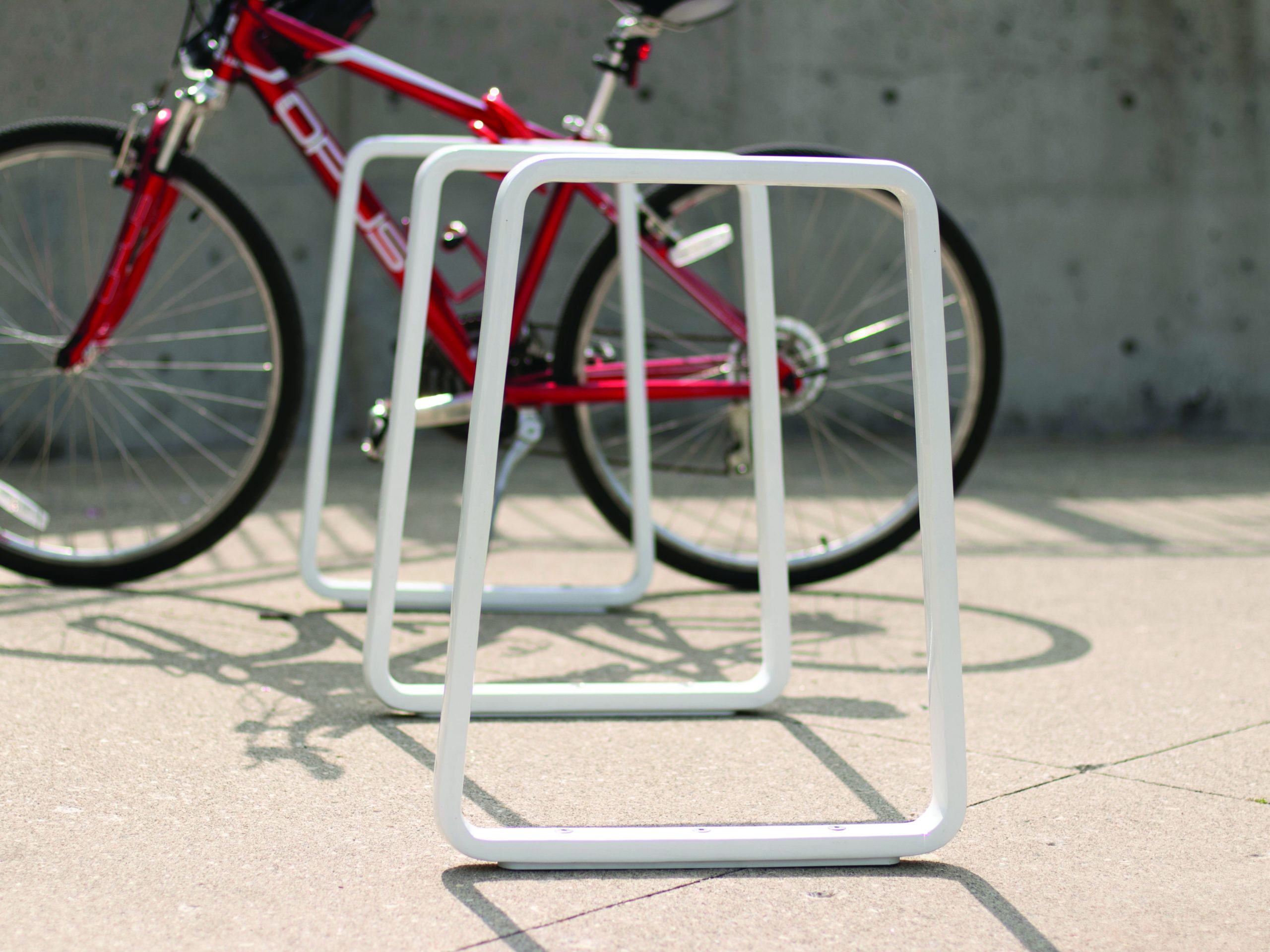 White Iconic Bike Racks with Red Bike