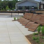 720 wooden chaise lounge with building in background