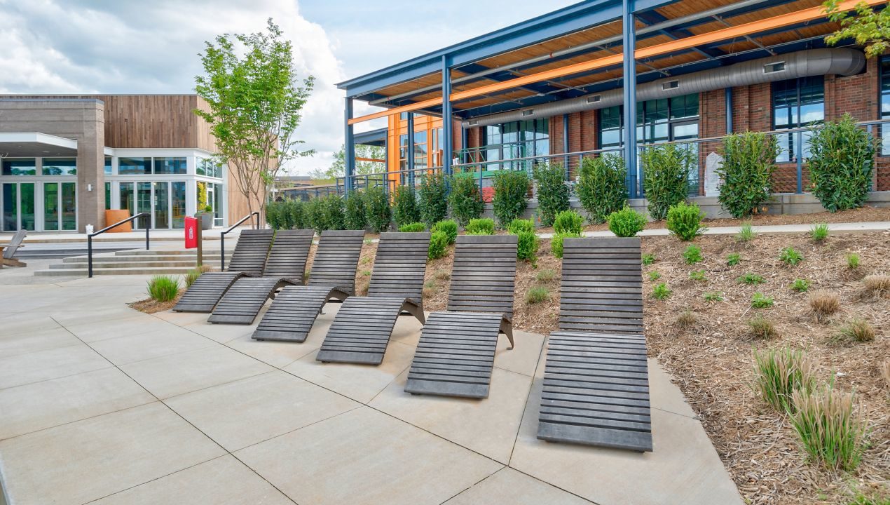 Kingsley-720-Chaise-003 720 wood chaise lounge in a row with building behind