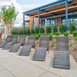 720 wood chaise lounge in a row with building behind