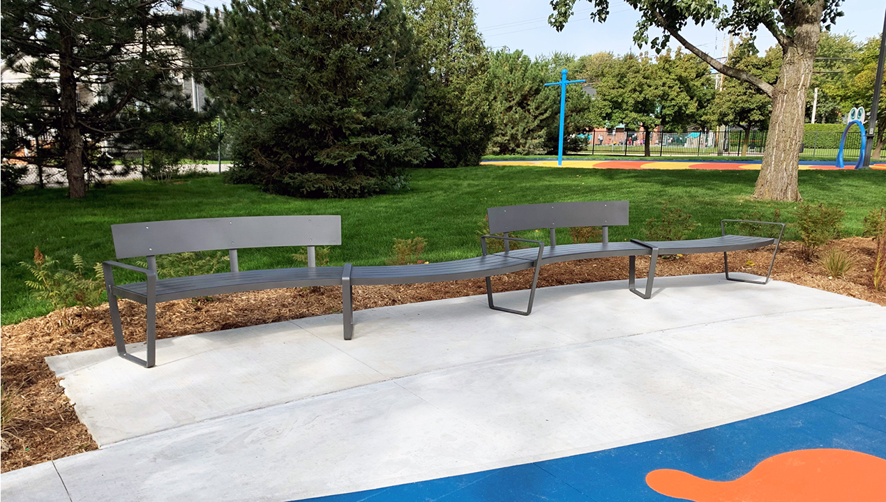 Curvy Lexicon Benches with and without backs in park setting
