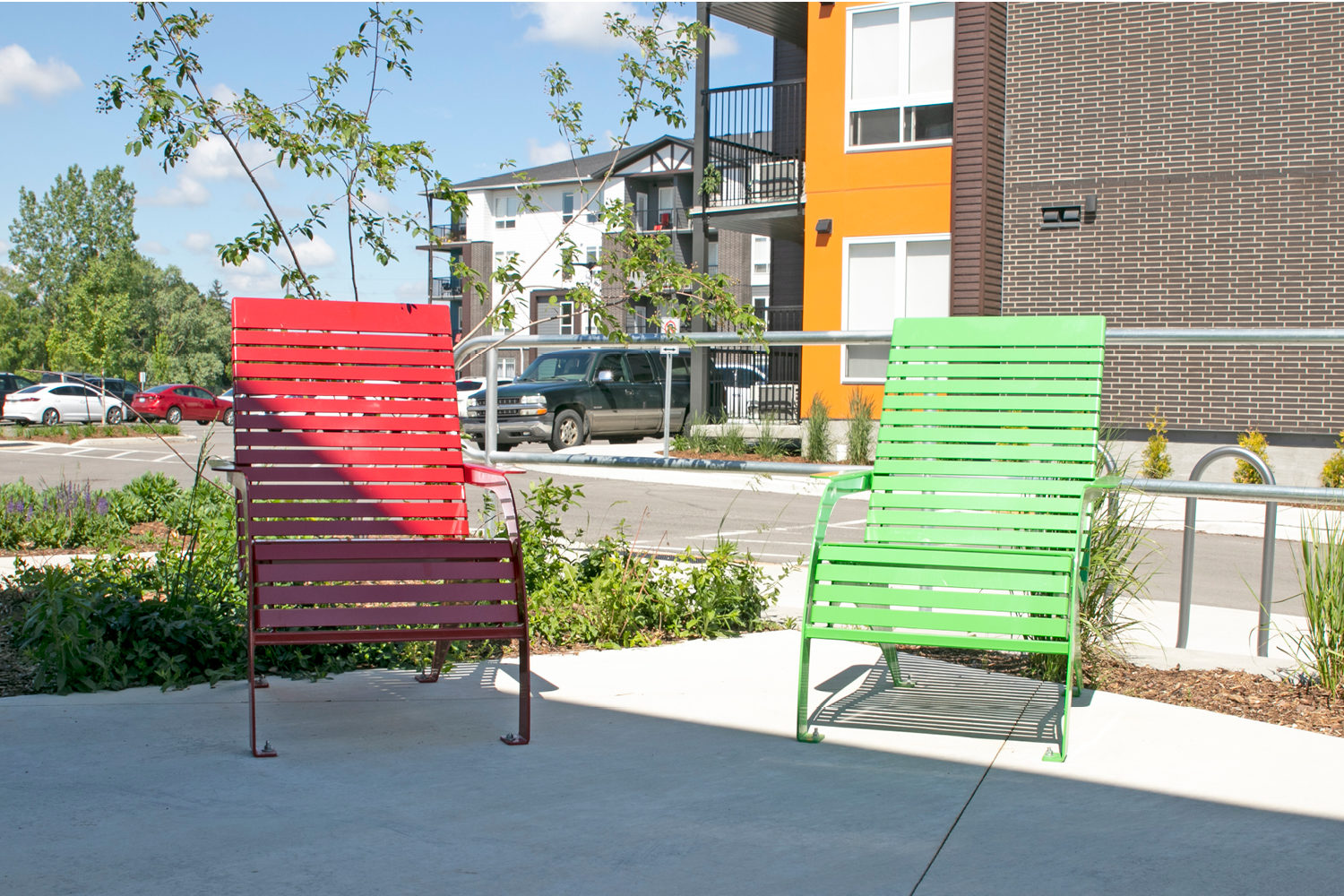 MCH-0720-Chairs_Sterling-Apartments Red and Green powdercoated 720 chairs at apartment complex