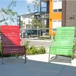 Red and Green powdercoated 720 chairs at apartment complex