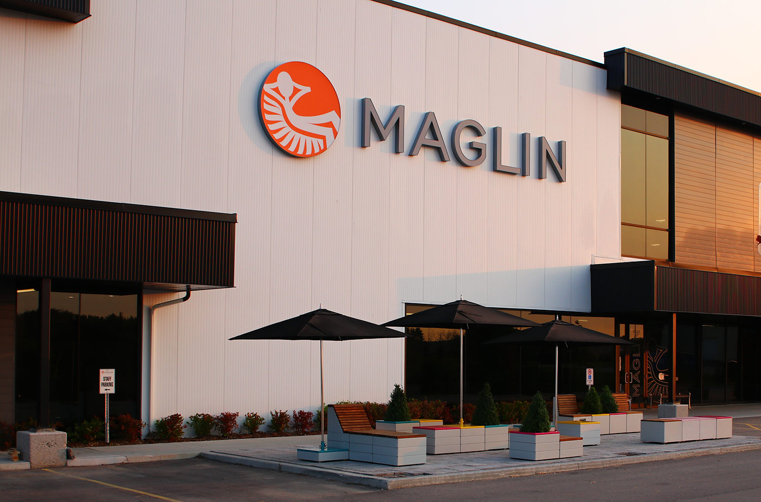 Maglin Logo on Building with patio below