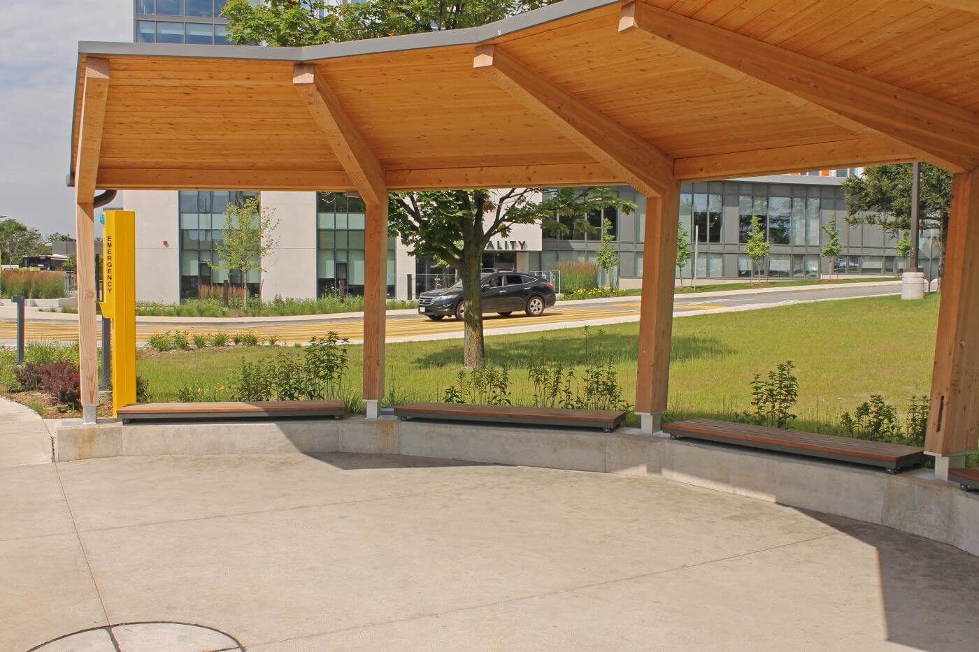 Straight Ogden Wall-Mount benches underneath sun shade