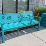 Blue Bench with Design and Trash Can