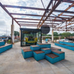 Pixel blocks painted turquoise at Camp North End