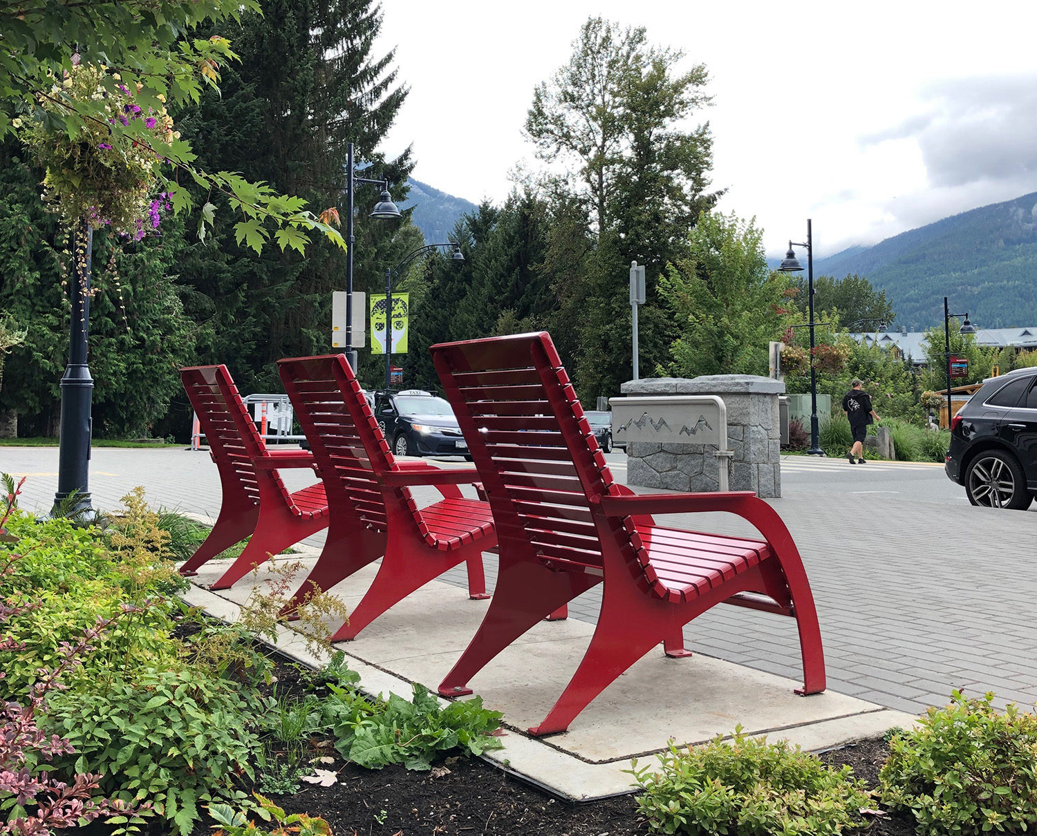 3 Red 720 Chairs overlooking the mountains