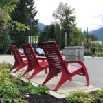 3 Red 720 Chairs overlooking the mountains