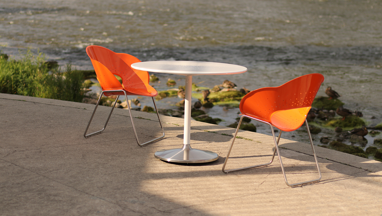 Orange Battery Chairs overlooking a river