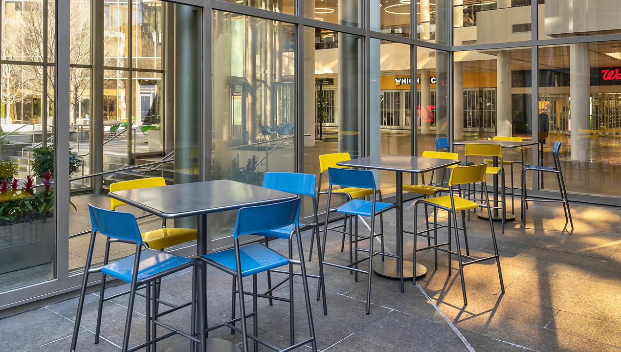 Yellow and Blue Chairs at tall square tables