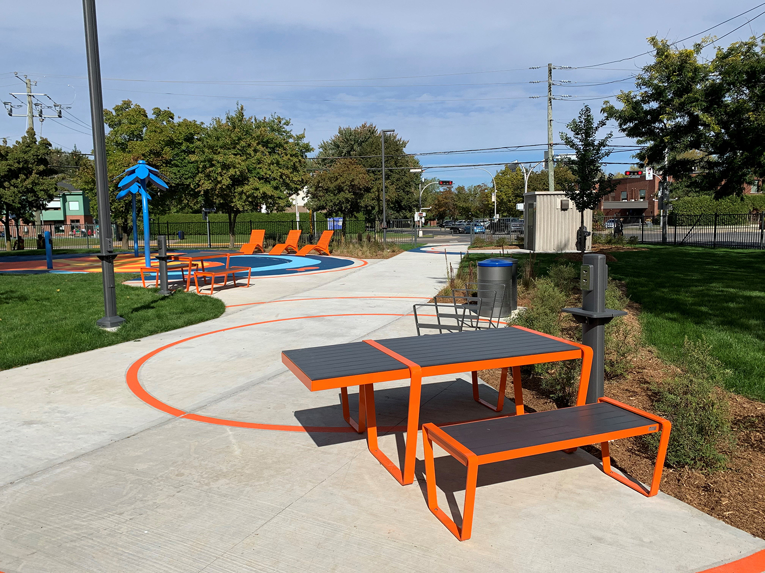 lexicon-tables-wheelchair-accessible Bright orange Lexicon table with wheelchair accessibility in park