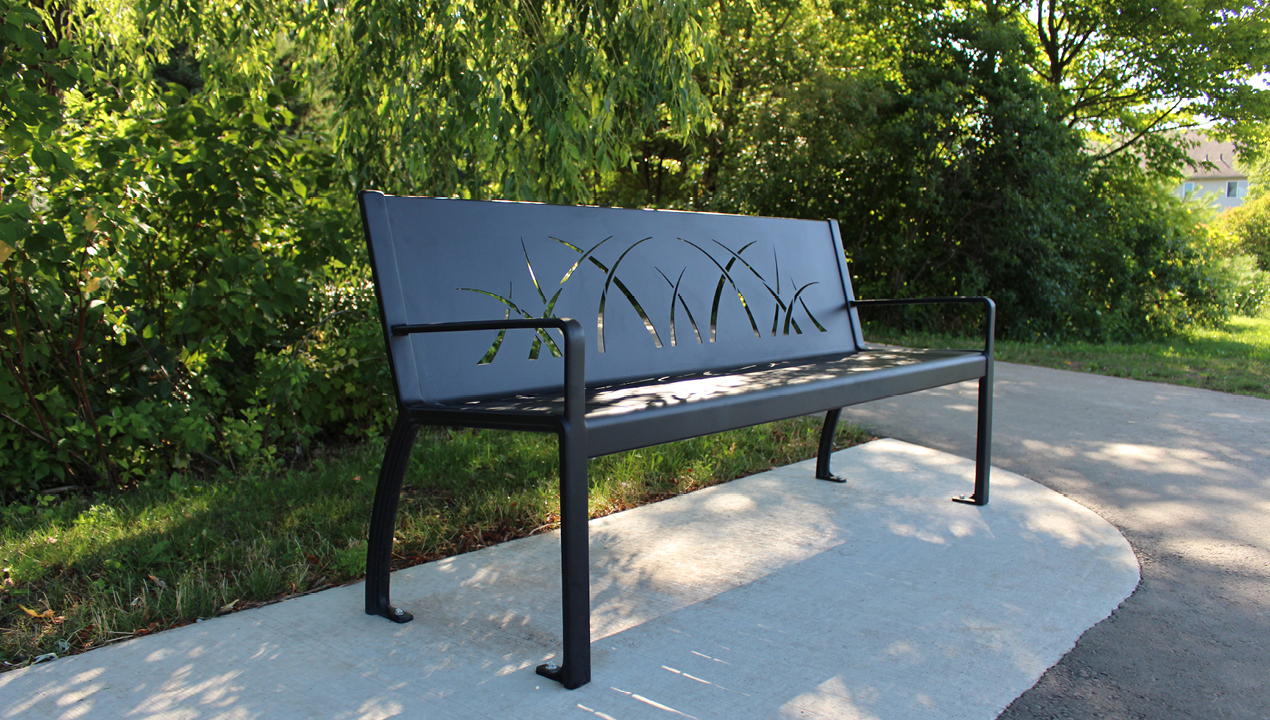 970 Bench with grass pattern sitting in park