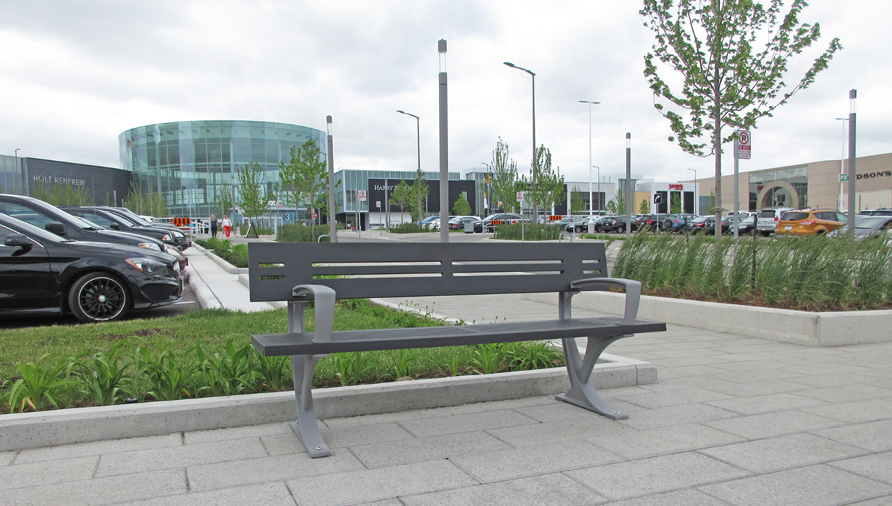 Silver Backed Bench with Arms near Commercial Area
