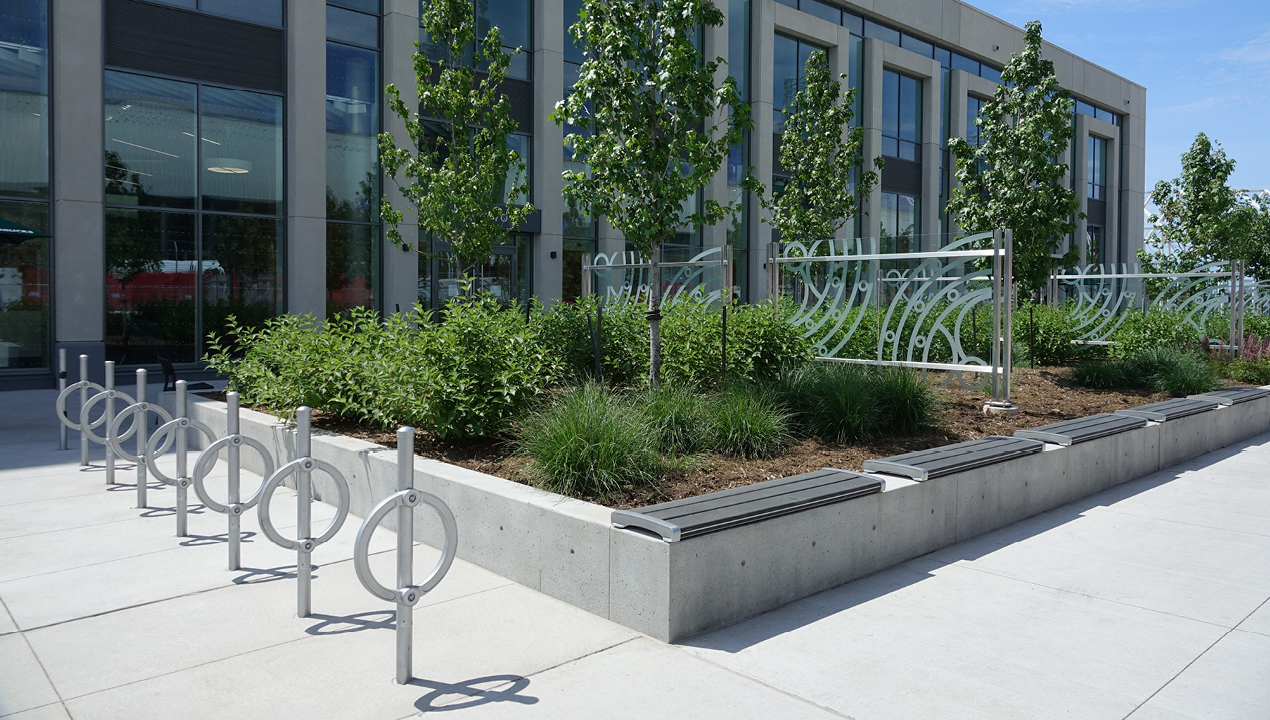Silver Bike Racks with direct burials outside of building
