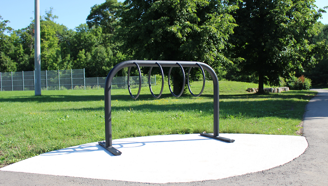 300 Style Bike Rack in park with sun shining and trees