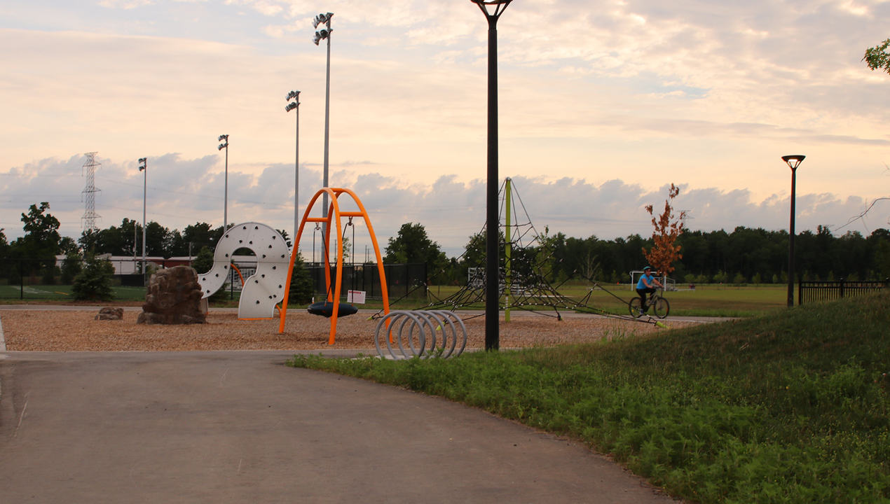 Silver Loop Bike Racks at a children's playground