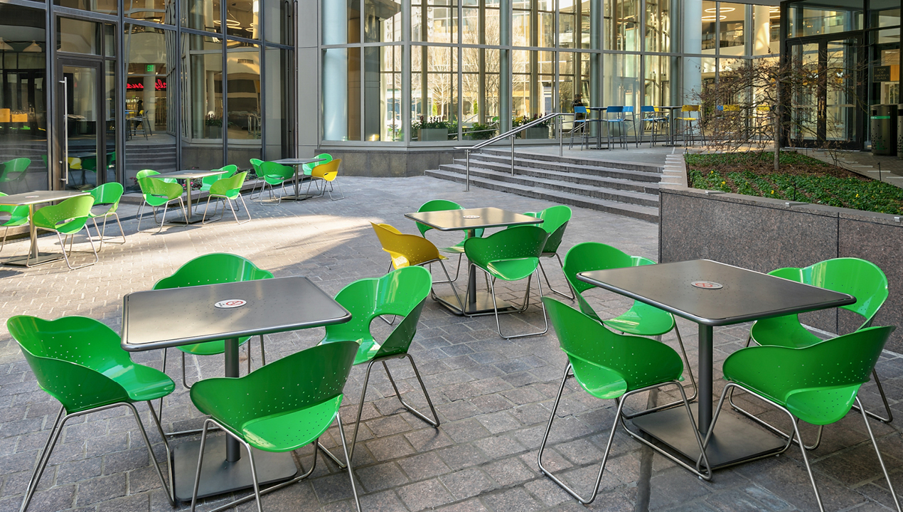 Green and Yellow Battery Chairs outside of Building