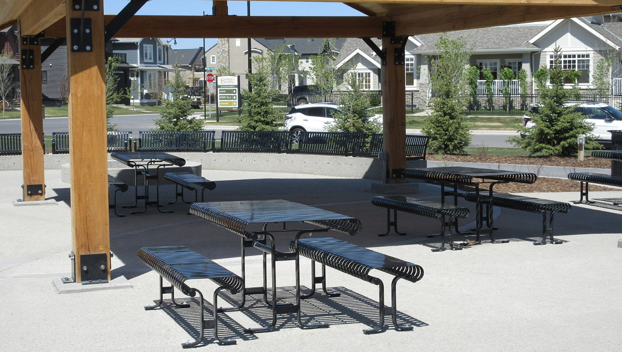 Metal Table with Metal Benches under Pavilion near Subdivision