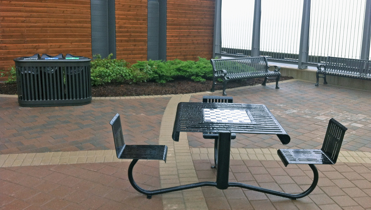 Black WheelChair Accessible Table with Chess Board inside Building
