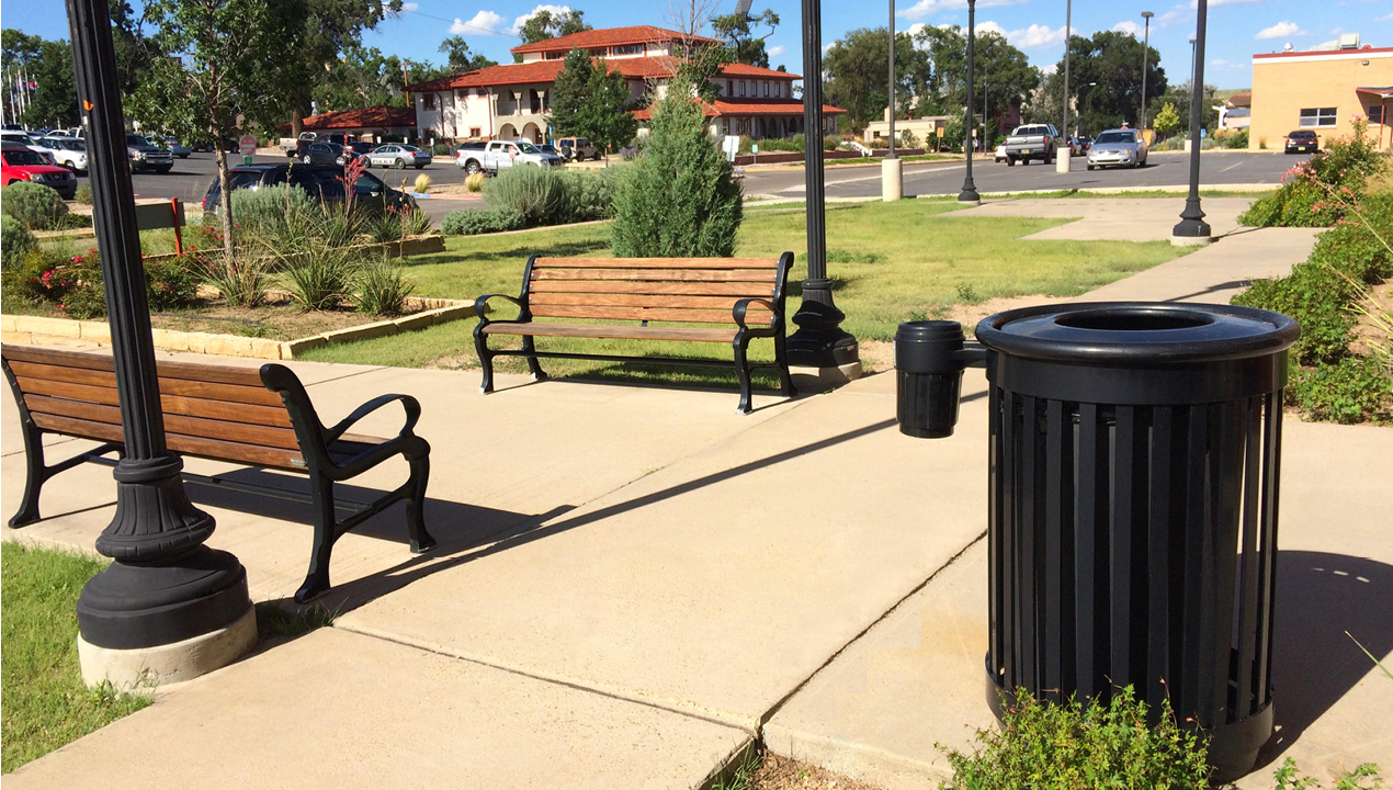 Black Trash Can and Wood Benches in Outside area