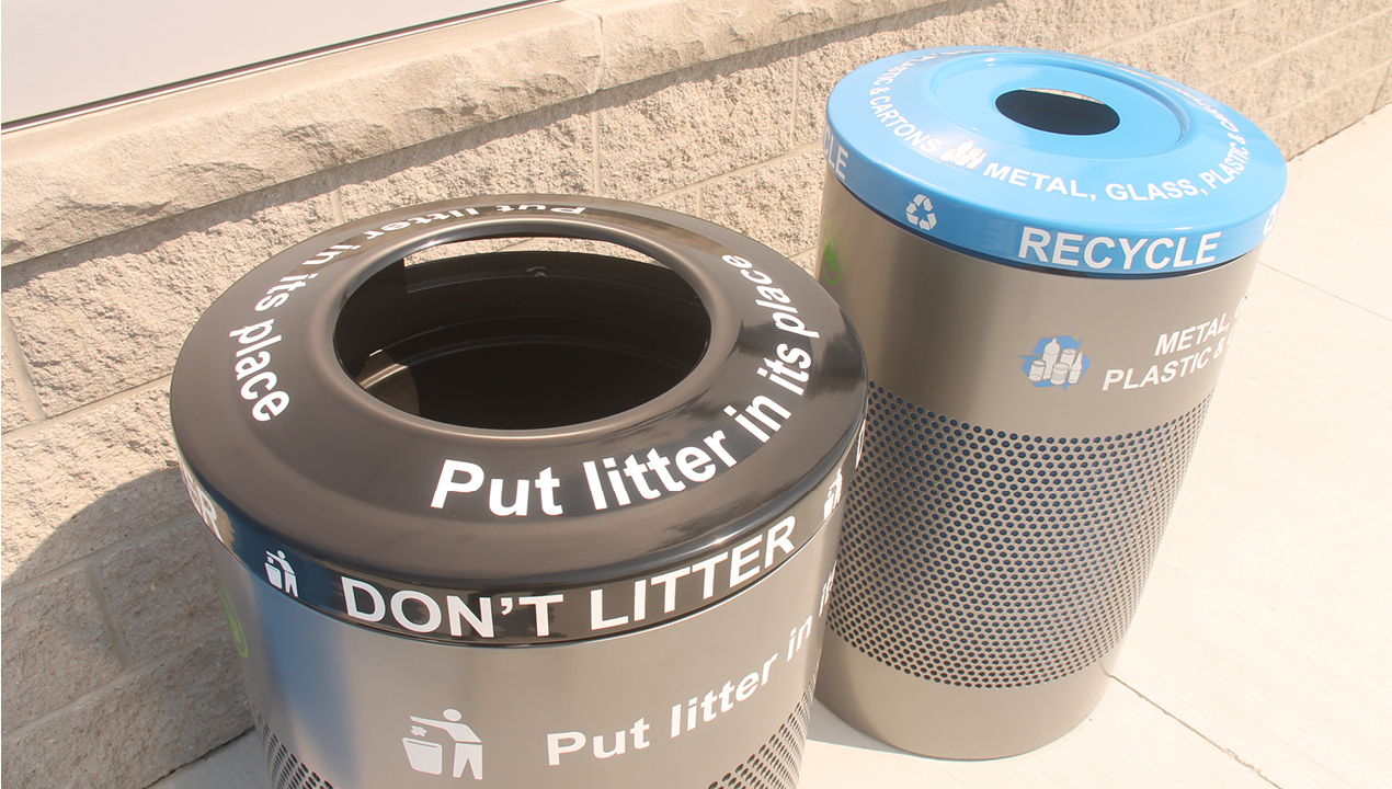 Garbage and Recycling bins with a black and blue top