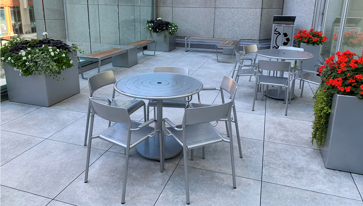 Silver Foro table and chairs, 1500 planters and Lexicon