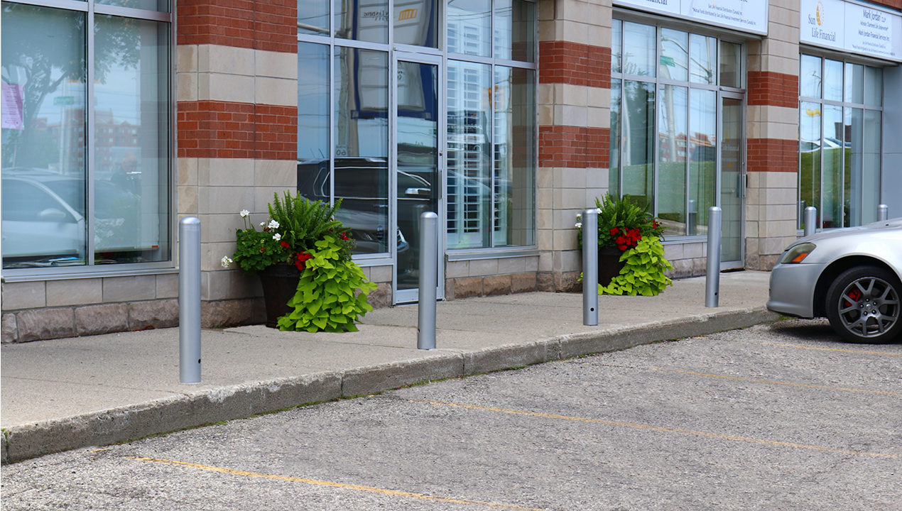 mbo-0500-series 500 Series Bollards painted silver in front of office building