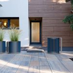 MUG Planters and Waste/Recycle Container in front of building