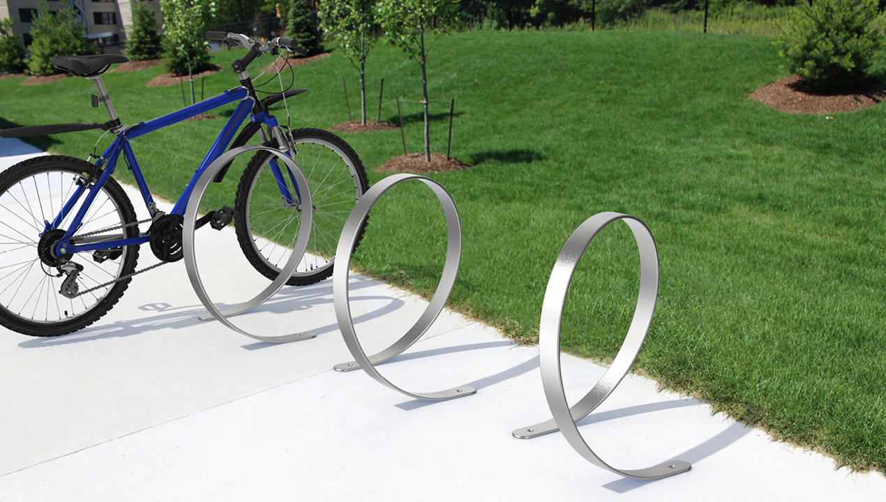 3100 Series - Orbit Stainless Steel Bike Racks with blue bicycle at park