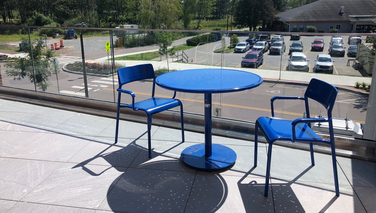 Foro Collection Round Table and Chairs, blue powdercoat on balcony