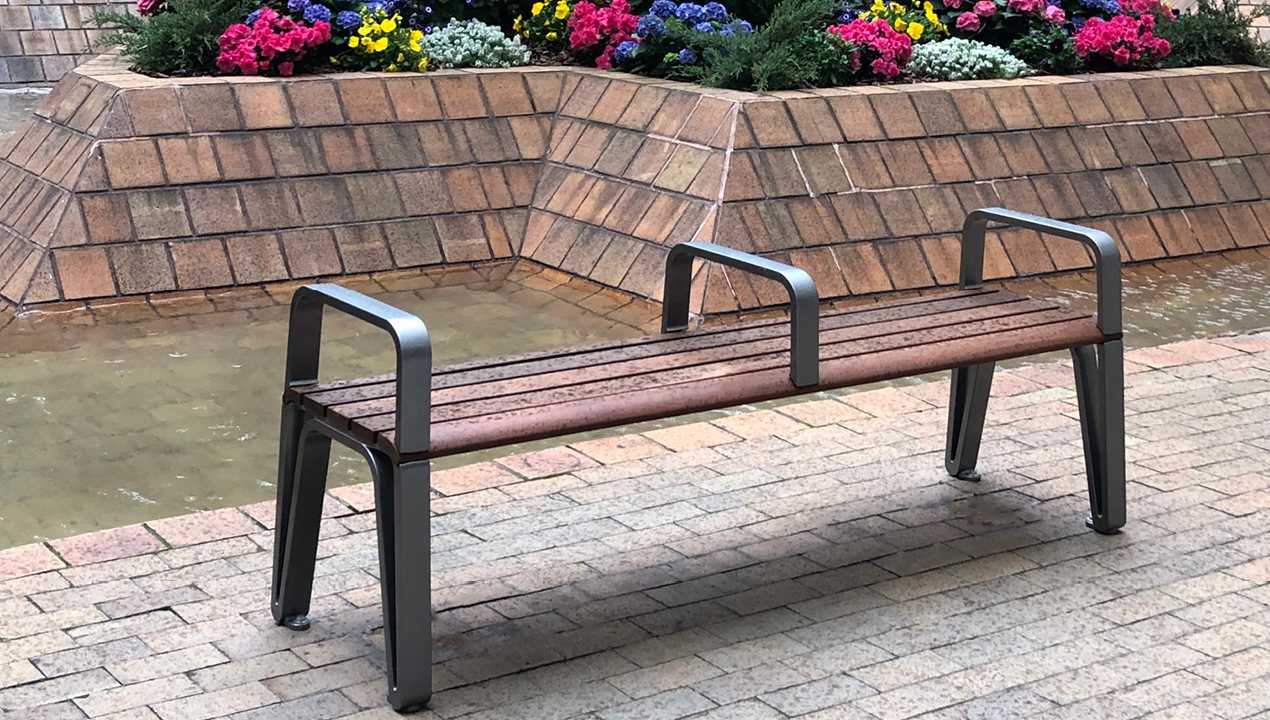 Iconic Backless bench with side and center arms in plaza
