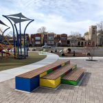 A multicolored Pixel layout next to a school playground.