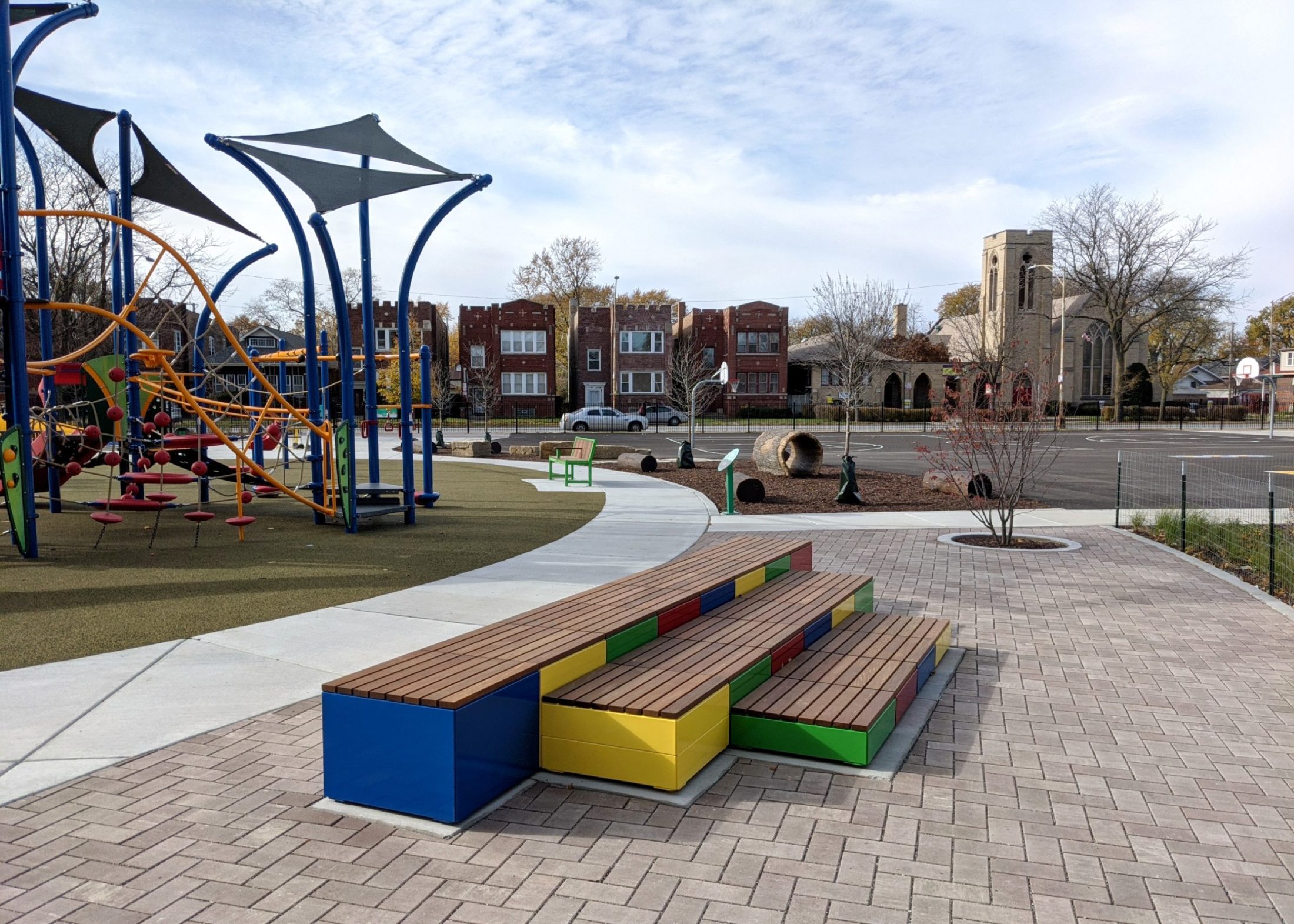 A multicolored Pixel layout next to a school playground.