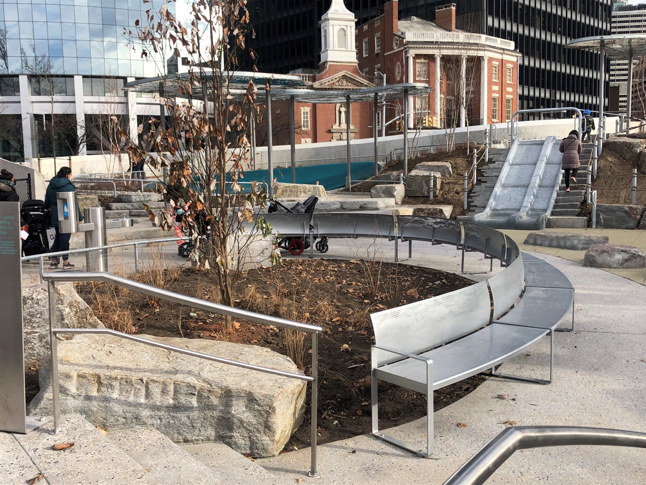 NY_Battery Playscape_Bench Custom curved steel perforated bench in the Battery Playscape
