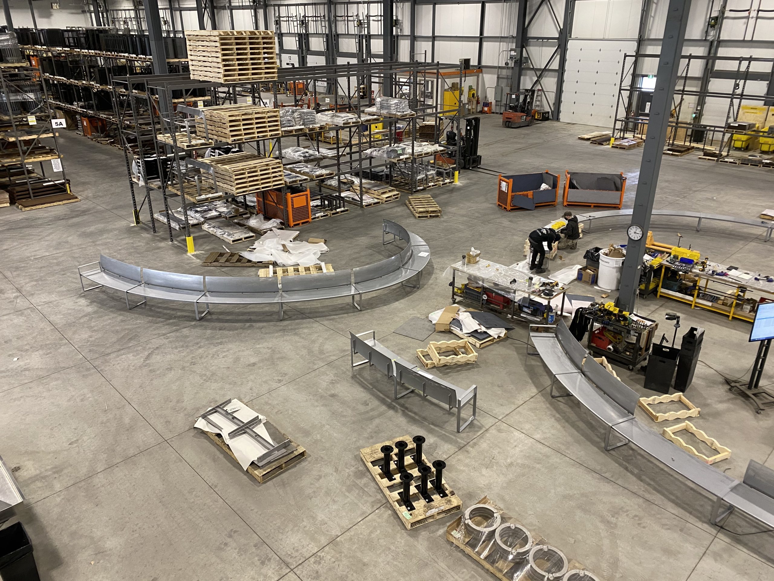 Battery Playscape_Curved Benches_Warehouse_004 overhead view of battery playscape site amenities in a warehouse