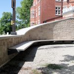Curved Ogden Cantilever Bench with custom wood at Lang Plaza