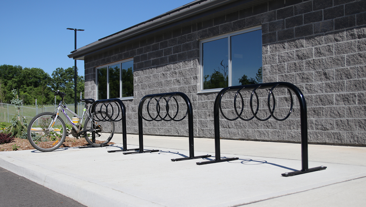 MBR-0300 Bike Rack painted gloss black next to building