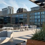 Foro Collection tables and seating on rooftop patio