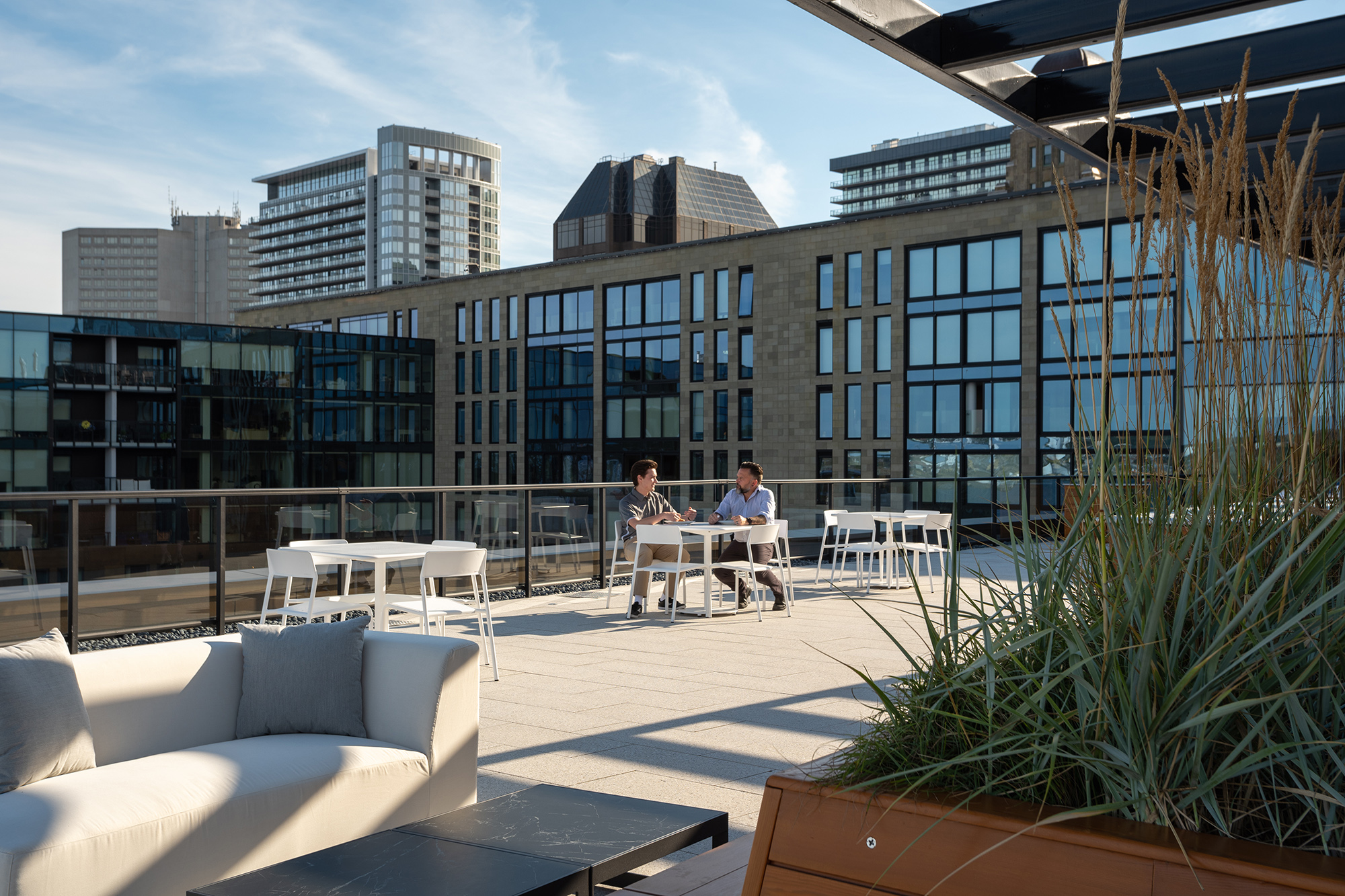 FORO_StewartMc_rooftop Foro Collection tables and seating on rooftop patio